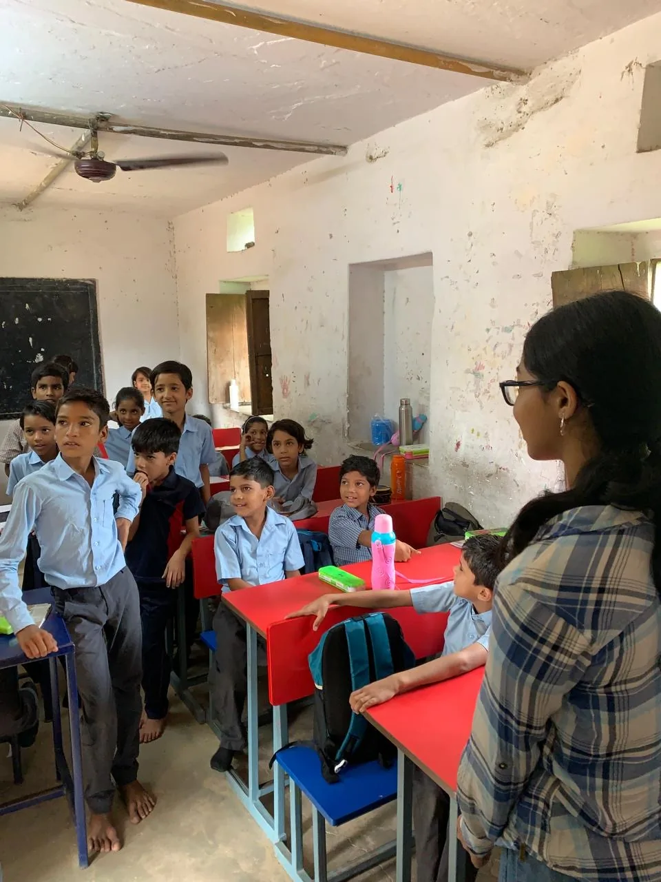 Myra Jhawar facing a classroom of attentive students