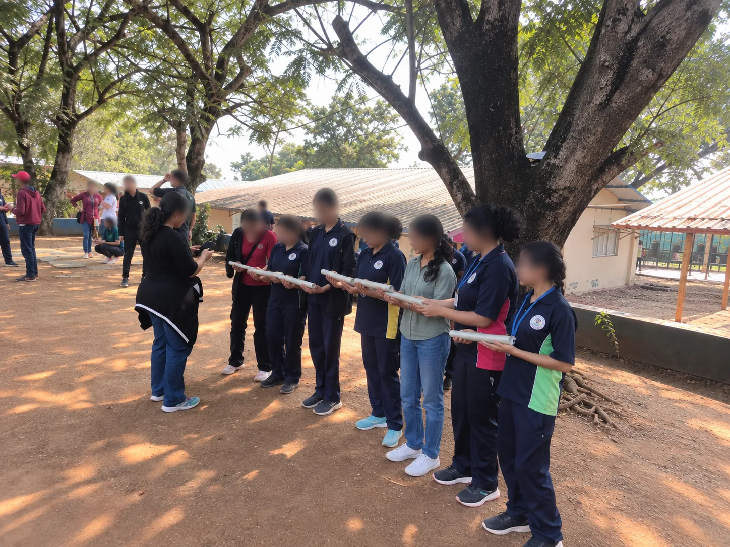 Students and volunteers in a line outdoors at TABIS, faces blurred